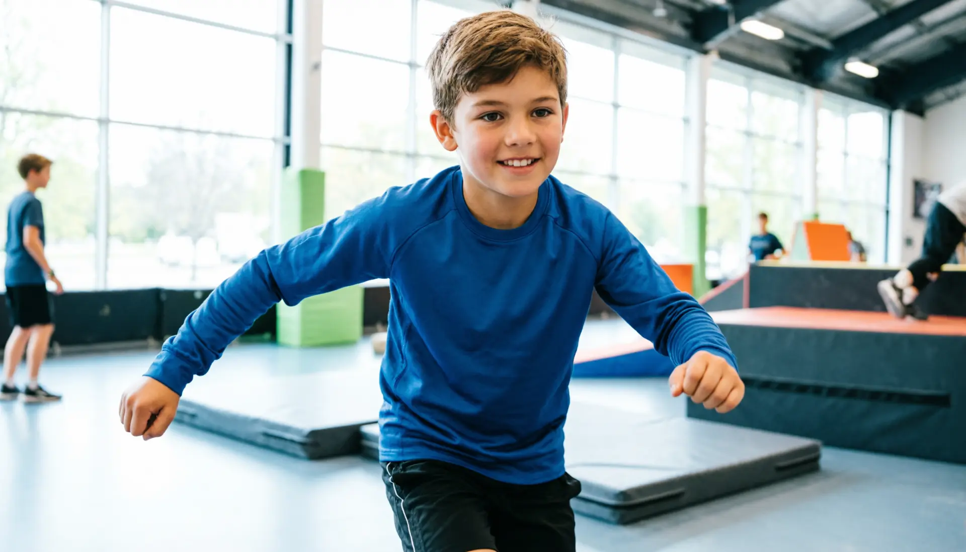 Young boy enjoying a parkour class